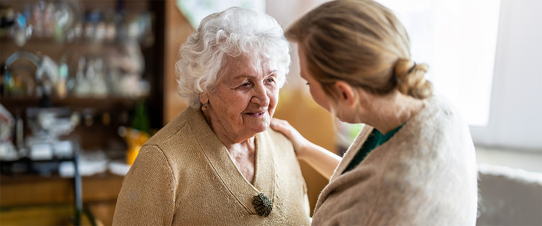 A senior woman and her friend talking